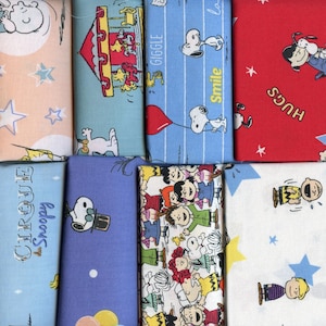 PEANUTS SNOOPY Cotton Fabric. Whimsical Circus & Happiness Snoopy, Charlie and Sally Brown fabric for sewing, quilting, crafts and more.