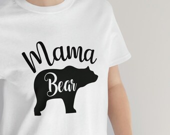 May include: White t-shirt with black text that reads "Mama Bear" and a black bear silhouette.