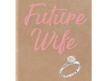 May include: A brown leather-bound journal with the text "Future Wife" in pink script. A silver ring with a diamond is shown below the text.