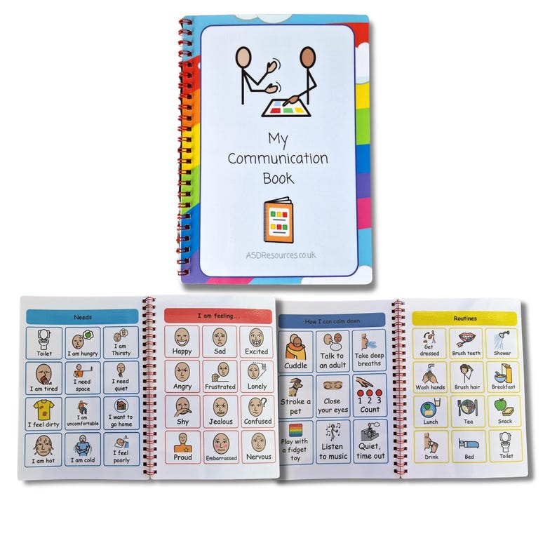 May include: A colorful communication book with a spiral binding. The cover features a rainbow design and the text "My Communication Book". The book is divided into sections for needs, feelings, how I can calm down, and routines. Each section has colorful illustrations and text.