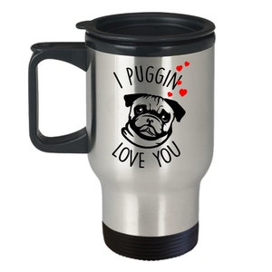 May include: A silver travel mug with a black lid and handle. The mug has a black and white image of a pug with the text "I puggin' love you" and red hearts.