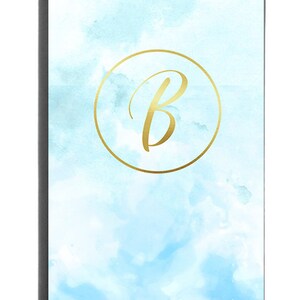 May include: A light blue watercolor background with a gold circle and the letter "B" in gold script.
