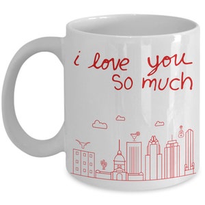 May include: White ceramic coffee mug with a red outline of the Austin, Texas skyline and the text "i love you so much".