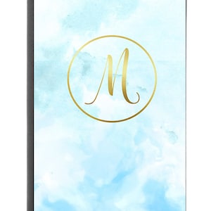 May include: A light blue watercolor background with a gold circle and the letter "M" in a gold cursive font.