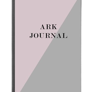 May include: A pink and gray journal with the text "ARK JOURNAL" on the front cover.