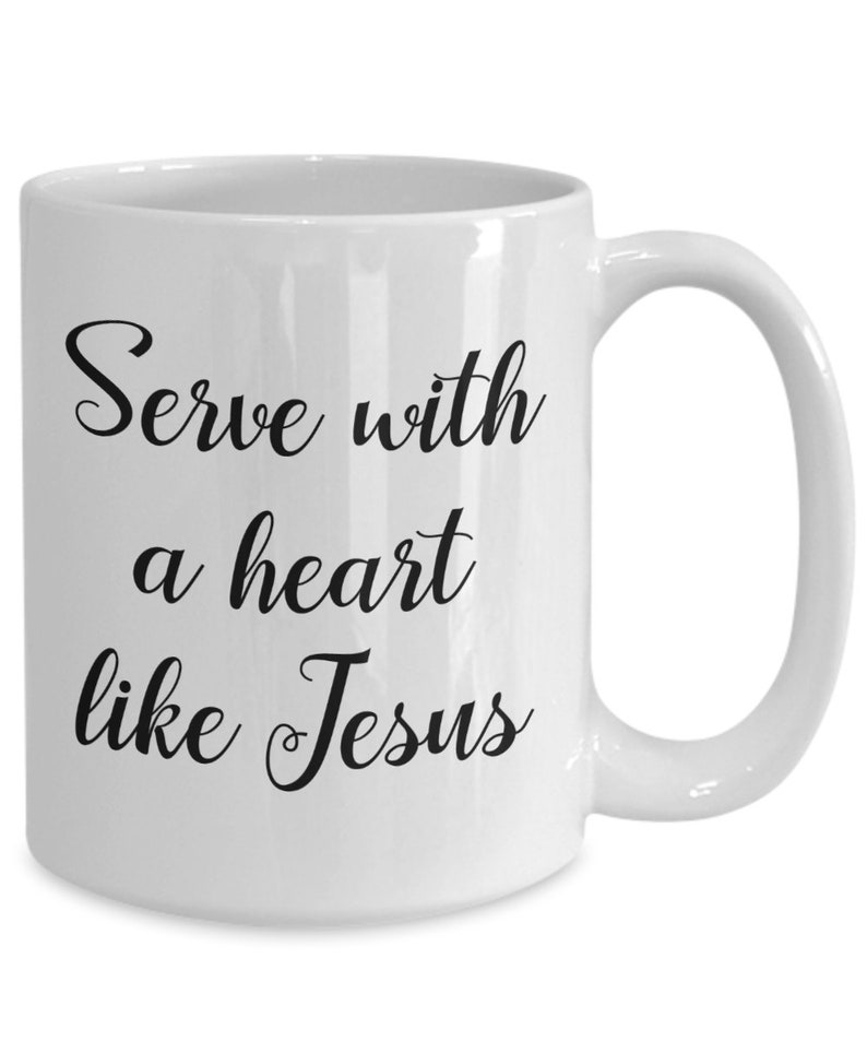 May include: White ceramic coffee mug with black text that reads "Serve with a heart like Jesus".