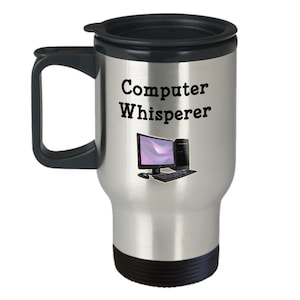 May include: A silver travel mug with a black lid and handle. The mug has the text "Computer Whisperer" printed on it, along with a black computer monitor, tower, keyboard, and mouse.