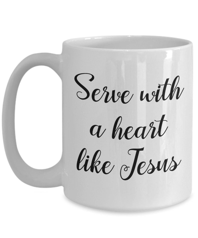 May include: White ceramic coffee mug with black text that reads "Serve with a heart like Jesus".