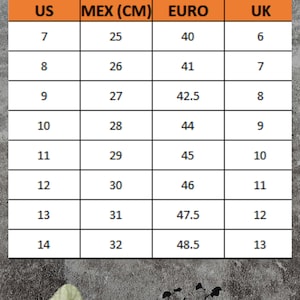 May include: Shoe size conversion chart with US, MEX (CM), EURO, and UK sizes. The chart ranges from US size 7 to 14, with corresponding measurements in centimeters, European sizes, and UK sizes. The background is a textured gray surface with decorative leaves.