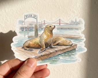 Adesivo de viagem em aquarela com leões-marinhos do Píer 39 de São Francisco.