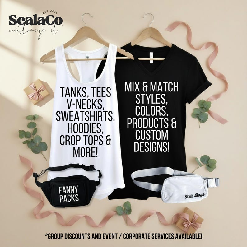 a variety of clothing items and accessories, including a white tank top, a black t-shirt, a black and white fanny pack, and a white tote bag, all displayed on wooden hangers. The text on the items reads "Mix & Match STYLES, COLORS, PRODUCTS & CUSTOM DESIGNS!" and "*GROUP DISCOUNTS AND EVENT / CORPORATE SERVICES AVAILABLE!".