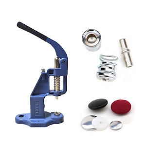 May include: A blue metal button press machine with a black handle. The machine is used to attach buttons to fabric. The image also shows a variety of button parts, including a spring, a metal post, and a button.