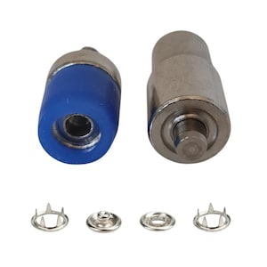 May include: A set of metal snap fasteners with a blue-tipped tool and a silver tool. The set includes four snap fastener components, ideal for various crafting and repair projects. The tools are designed for easy installation.