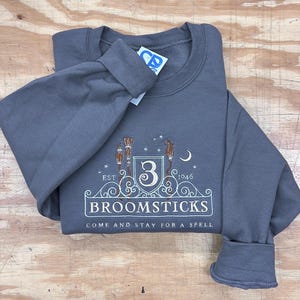 Broomsticks Embroidered Crewneck Sweatshirt