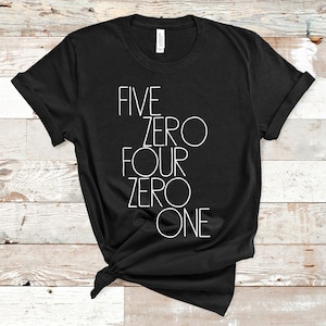 May include: Black t-shirt with white text that reads "FIVE ZERO FOUR ZERO ONE".