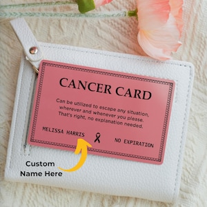 May include: A pink "Cancer Card" with black text, displayed on a white wallet. The card reads "Can be utilized to escape any situation, wherever and whenever you please. That's right, no explanation needed."