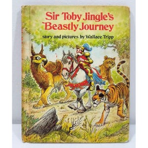 Puede incluir: Portada de libro infantil vintage "Sir Toby Jingle's Beastly Journey" con ilustraciones de un caballero a caballo, un grifo, un tigre y un león. La portada tiene un aspecto desgastado, lo que indica que es un libro usado.