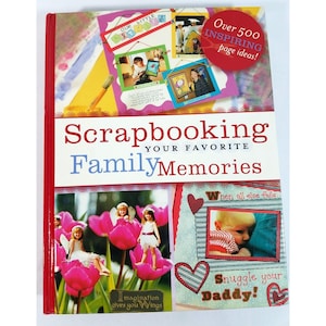 May include: A hardcover book titled "Scrapbooking Your Favorite Family Memories." The cover features photos, illustrations, and the text "Over 500 Inspiring Page Ideas!" and "Imagination gives you Wings."