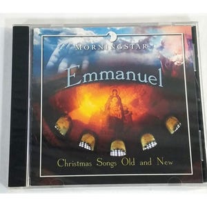 May include: A CD case featuring the album "Emmanuel" by Morningstar. The cover art displays a celestial scene with the title in elegant script. The text "Christmas Songs Old and New" is also visible. The case is in a clear plastic jewel box.