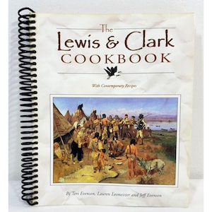 May include: The Lewis & Clark Cookbook with contemporary recipes. The cover features a painting of a group of people in a Native American village setting.