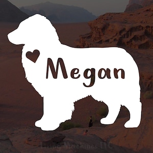 Puede incluir: Silueta blanca de un perro con un corazón y el nombre Megan escrito en él. La silueta está sobre un fondo rocoso marrón.