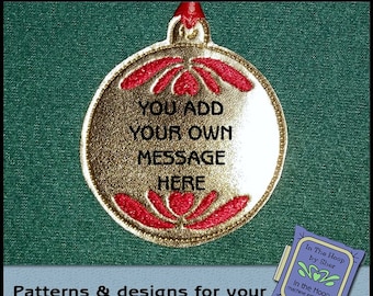 May include: Gold and red Christmas ornament with the text "YOU ADD YOUR OWN MESSAGE HERE".  The ornament is on a green background.  Patterns and designs for your embroidery machine.
