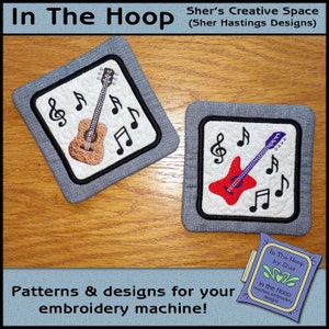 May include: Two embroidered designs featuring a guitar and musical notes. The designs are on a gray fabric background and are perfect for embroidery projects.