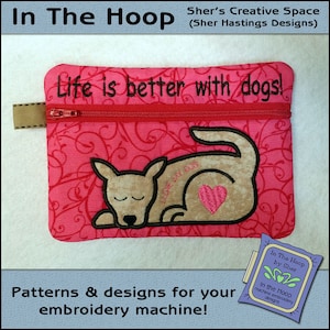 May include: A pink zippered pouch with a red heart and a brown dog embroidered on it. The pouch has the text "Life is better with dogs!" embroidered on it.