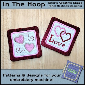 May include: Two embroidered designs for a sewing machine. One design features a heart with the word "Love" and the other design features three hearts and swirls. Both designs are on a white background with a red border.