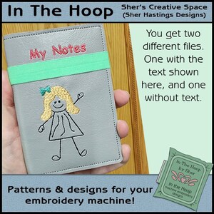May include: A gray leather notebook with a green elastic band and the text "My Notes" embroidered on the front. A stick figure girl with blonde hair is also embroidered on the front. The notebook is being held by a hand. The image is for a machine embroidery design.
