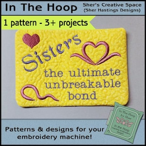 May include: A yellow square embroidery design with the text "Sisters the ultimate unbreakable bond" in purple and pink. Two pink hearts are embroidered on the design. The design is on a yellow fabric with a textured surface.