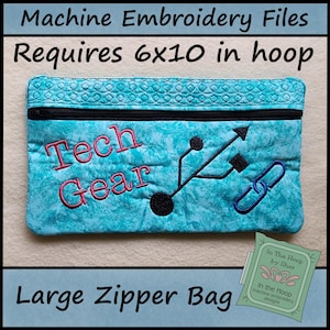 May include: A turquoise large zipper bag with a black zipper and the words "Tech Gear" embroidered in pink. The bag features a USB symbol and a chain link design. The text "Requires 6x10 in hoop" is at the top.