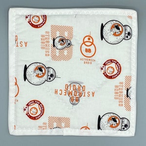May include: Square white fabric item featuring a repeating pattern of orange and black BB-8 droid illustrations and text. The text includes "ASTROMECH DROID", "JOIN THE RESISTANCE", and "STROMECH DROID". The edges have a white border.