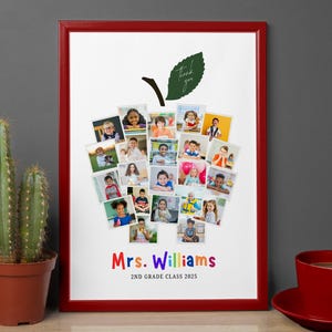 May include: A framed print with a red border features a collage of children's photos arranged in the shape of an apple. The apple has a green leaf and stem. The text "Mrs. Williams 2nd Grade Class 2025" is below the apple.