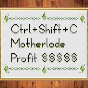 May include: Cross-stitch art in a gold frame on a wood background. The text reads "Ctrl+Shift+C Motherlode Profit $$$$$" in black and green. The design includes decorative green and black borders.
