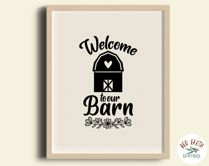 May include: Black and white printable wall art featuring a barn with a heart on the roof and the text "Welcome to our Barn". The barn is surrounded by a floral design.