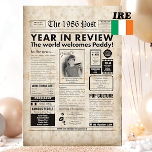 May include: A retro newspaper print from 1986, titled "The 1986 Post," with the headline "Year in Review." The print includes articles, a photo, and the text "Happy 40th Birthday! We Love You!" with balloons in the background.
