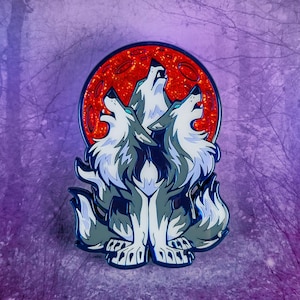 May include: Three grey wolves howling at a red glitter moon. The wolves are stylized and have a blue outline. The moon is a circle with a red glitter texture.