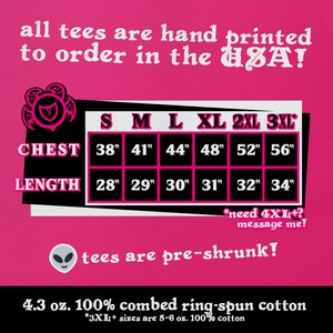 May include: Pink graphic with a size chart for t-shirts. The chart shows chest and length measurements in inches for sizes S, M, L, XL, 2XL, and 3XL. The text "all tees are hand printed to order in the USA!" is at the top of the graphic. The text "tees are pre-shrunk!" is in the middle of the graphic. The text "4.3 oz. 100% combed ring-spun cotton" is at the bottom of the graphic. The text "*3XL+ sizes are 5-6 oz. 100% cotton" is below the text "4.3 oz. 100% combed ring-spun cotton".