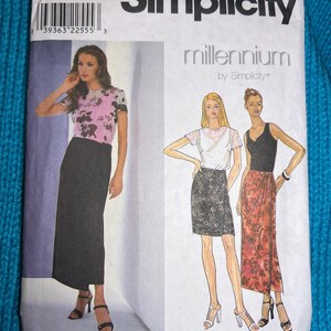 May include: A Simplicity sewing pattern package featuring a woman in a pink floral top and black skirt. The package includes illustrations of skirt designs and the text "Simplicity Millennium". The size is D 4,6,8.