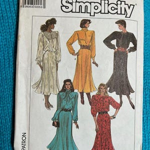 May include: Simplicity sewing pattern featuring illustrations of five different dresses. The pattern number is 8174, and the size is NN (10-16). The European size is NN (38-44). The dresses are in various colors, including white, yellow, black, teal, and red.