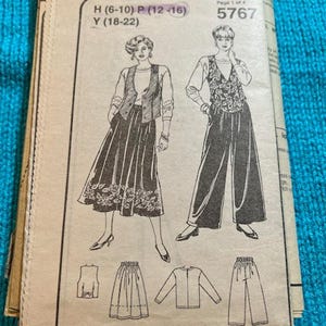 May include: A vintage sewing pattern showing illustrations of women's clothing, including a skirt, trousers, and a waistcoat. The pattern is labelled with sizes H (6-10), P (12-16), and Y (18-22). The pattern number is 5767. The pattern is printed on beige paper.