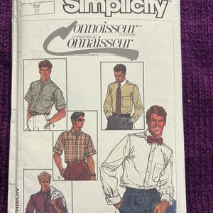 May include: Simplicity Connoisseur pattern envelope featuring shirt designs. The envelope displays images of men's shirts in various styles, including short-sleeved and long-sleeved options. The color palette includes white, blue, and plaid patterns.