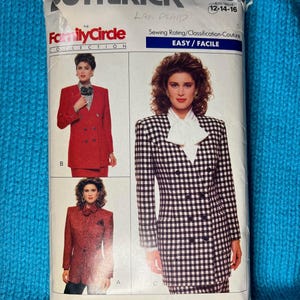 May include: A vintage sewing pattern for a blazer and skirt. The pattern is for sizes 12-14-16 and is labeled "Easy/Facile". The pattern is for a plaid fabric and is from the "Family Circle Collection".