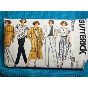 May include: A vintage sewing pattern from Butterick for a women's wardrobe. The pattern includes a blazer, skirt, pants, and a dress. The pattern is for sizes 6-12.