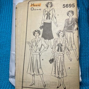 Läsarens mail Symönster pullover topp A-linjeformad kjol skärp storlek 6 8 10