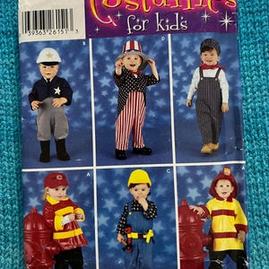 May include: A Simplicity pattern for children's costumes. The pattern includes six different costumes: a police officer, Uncle Sam, a train conductor, a firefighter, a construction worker, and a second firefighter. The pattern is for sizes 1/2, 1, 2, 3, and 4.
