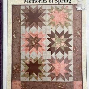 May include: A quilt pattern titled "Four Plus One Equals Fun: Memories of Spring" featuring star designs in shades of brown, pink, and green. The pattern includes the text "From my heart to your hands: Lori Smith".