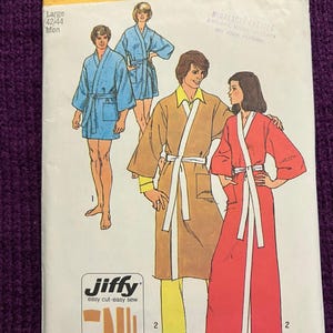 May include: A vintage Simplicity sewing pattern, number 5685, with illustrations of bathrobes. The pattern includes a size range for men, with the size range of 42-44. The pattern is labeled "Jiffy easy cut easy sew".