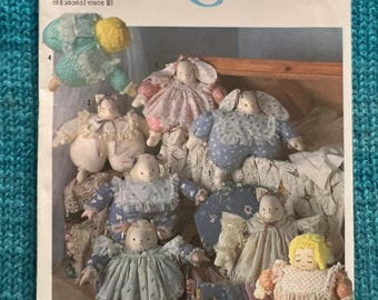 May include: A Simplicity Crafts sewing pattern for making a variety of stuffed animals. The pattern includes instructions for making a bunny, a lamb, and a pig. The pattern is for one size and is numbered 7089.